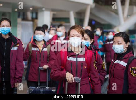 200318 -- WUHAN, March 18, 2020 -- Medics from southwest China s Guizhou Province arrive at Wuhan Railway Station to take the train in Wuhan, central China s Hubei Province, March 17, 2020. Medical assistance teams started leaving Hubei Province early on Tuesday as the epidemic outbreak in the hard-hit province has been subdued.  CHINA-WUHAN-MEDICS-DEPARTURE-FAREWELL CN XiaoxYijiu PUBLICATIONxNOTxINxCHN Stock Photo