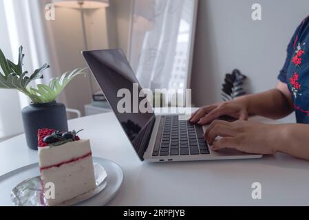 Woman hands typing on laptop computer keyboard, Freelancer Chatting Over the Internet on Social Networks, online learning, internet marketing, working Stock Photo