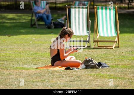 London, UK. 5th Sep, 2023. UK weather, Sunny day in St James Park and Horseguards Parade, London UK Girl Sunbathing Credit: Ian Davidson/Alamy Live News Stock Photo