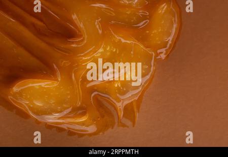 Transparent cosmetic gel on yellow background Stock Photo