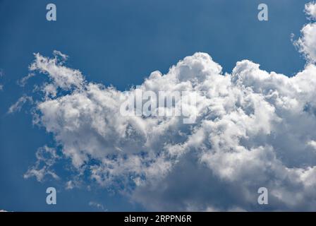White clouds, blue summer sky over New York Harbor (Upper Bay); puffy altocumulus clouds. Very large high-res file (45MP - 8120x5460px). Stock Photo