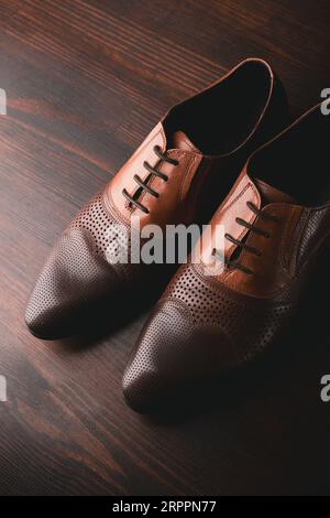 Men shoes on brown wooden background Stock Photo