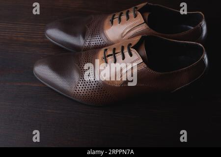Men shoes on brown wooden background Stock Photo