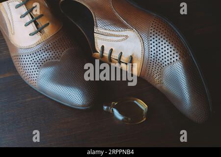 Men shoes on brown wooden background Stock Photo