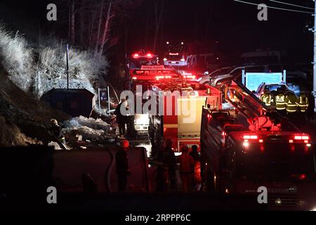 200320 -- TAIYUAN, March 20, 2020 -- Rescuers and vehicles gather near the fire area on Mount Wutai in north China s Shanxi Province, March 20, 2020. A fire has broken out on Mount Wutai, one of China s four sacred Buddhist mountains, in north China s Shanxi Province, the management committee of the scenic area said Friday. The fire broke out on Thursday evening near a parking lot on the mountain and 1,500 people have been sent to the area to battle the fire as of Friday noon, according to the committee. Water cannons and helicopters have also been used to put out the fire. As the burning poin Stock Photo