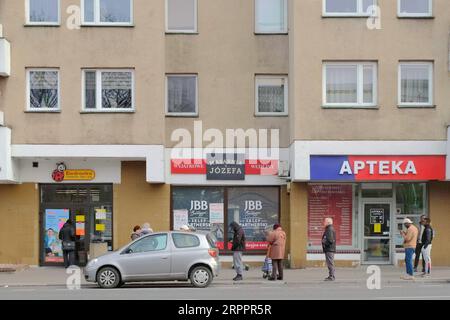 200321 -- WARSAW, March 21, 2020 Xinhua -- People stand apart while waiting outside a supermarket in Warsaw, Poland, March 20, 2020. Polish Prime Minister Mateusz Morawiecki said on Friday that Poland has introduced a state of epidemic emergency to curb the spread of the novel coronavirus. The prime minister also announced the introduction of tougher penalties for breaking quarantine rules and affecting location-tracking of people under quarantine. The number of Poland s confirmed coronavirus cases has risen to 425 and five people died from the COVID-19, the Polish Health Ministry announced on Stock Photo