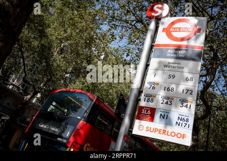 Bus numbers and times, including the new Superloop routes around the capital, are seen at a bus stop at Aldwych in the West End, on 5th September 2023, in London, England. Stock Photo