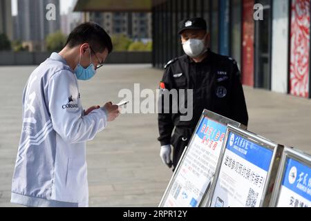 200324 -- HEFEI, March 24, 2020 -- A visitor scans QR code for health check before entering into the Anhui Museum in Hefei, east China s Anhui Province, March 24, 2020. Under strict measures taken to fight against the COVID-19, the Anhui Museum reopened in an orderly manner on Tuesday to visitors who have made real-name reservations and control the number of visitors below 2,000 a day. Before entering into the museum, each visitor has to scan QR code for health check and receive temperature checking. Photo by /Xinhua CHINA-ANHUI-HEFEI-ANHUI MUSEUM-REOPEN CN ZhouxMu PUBLICATIONxNOTxINxCHN Stock Photo