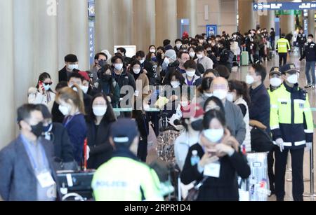 200324 -- SEOUL, March 24, 2020 -- Passengers from Frankfurt, Germany wait for buses to leave for quarantine facilities at Incheon International Airport, in Incheon, South Korea, March 24, 2020. South Korea reported 76 more cases of COVID-19 compared to 24 hours ago as of midnight Tuesday local time, raising the total number of infections to 9,037. The newly confirmed cases stayed below 100 for the third straight day. Of the new cases, 20 were imported from abroad. Newsis/Handout via Xinhua SOUTH KOREA-COVID-19 WangxJingqiang PUBLICATIONxNOTxINxCHN Stock Photo