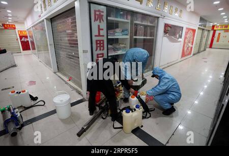 200327 -- WUHAN, March 27, 2020 -- Staff members prepare to disinfect a shopping mall at the Hanzheng Street in Wuhan, central China s Hubei Province, March 27, 2020. The shopping mall was thoroughly cleaned and disinfected before resumption of business.  CHINA-HUBEI-WUHAN-SHOPPING MALL-DISINFECTION CN WangxYuguo PUBLICATIONxNOTxINxCHN Stock Photo