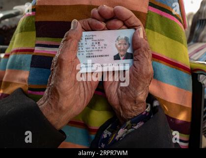 200328 -- LHASA, March 28, 2020 -- Sonam Drolma holds her identity card in Reguo Village of Gyaca County in Shannan, southwest China s Tibet Autonomous Region, March 24, 2020. Saturday marks the Serfs Emancipation Day. Sixty-one years ago, more than one million people, or 90 percent of the region s population of that time, were liberated from the feudal serfdom. Sonam Drolma is a 109-year-old villager in Reguo Village of Shannan. Since she was born, she has gone through half a century of twists and turns and sufferings as a serf. As a descendant of serfs, Sonam Drolma began to work for serf ow Stock Photo
