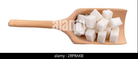 Sugar cubes in a scoop on a white background close-up. View from above. Sugar Stock Photo