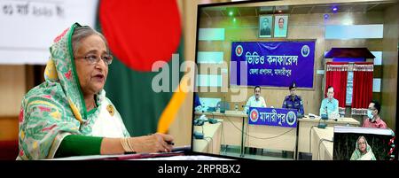 200331 -- DHAKA, March 31, 2020 Xinhua -- Bangladeshi Prime Minister Sheikh Hasina speaks at a video conference from her office in Dhaka, Bangladesh on March 31, 2020. Bangladeshi Prime Minister Sheikh Hasina on Tuesday said the government will extend the ongoing shutdown to manage the spread of COVID-19. She announced the government s plan while holding a video conference with senior government officials at the country s 64 districts. PID/Handout via Xinhua BANGLADESH-DHAKA-COVID-19-MEASURE PUBLICATIONxNOTxINxCHN Stock Photo