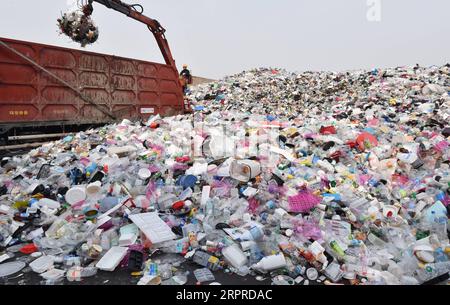 200401 -- SEOUL, April 1, 2020 -- A working staff of a recyclable garbage center deals with disposables in Suwon City of Gyeonggi Province, South Korea, April 1, 2020. South Korea reported 101 more cases of the COVID-19 compared to 24 hours ago as of midnight Wednesday local time, raising the total number of infections to 9,887. NEWSIS/Handout via Xinhua SOUTH KOREA-COVID-19 WangxJingqiang PUBLICATIONxNOTxINxCHN Stock Photo