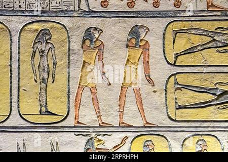 Ancient Egypt. Fragments of drawings and hieroglyphs on the walls. Close-up. Stock Photo