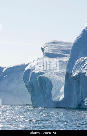 Impressive floating icebergs in the arctic sun in the UNESCO World Heritage Site Ilulissat Icefjord near Ilulissat. Ilulissat, Avanaata, Greenland Stock Photo