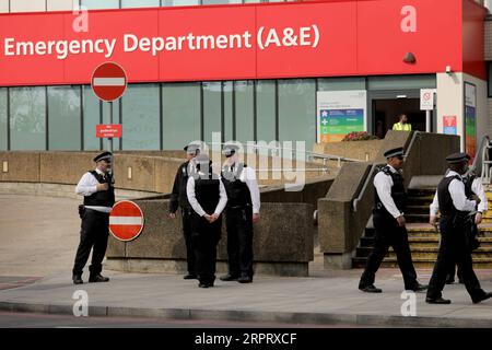 200409 -- LONDON, April 9, 2020 Xinhua -- Police stand guard St Thomas Hospital where British Prime Minister Boris Johnson remains in intensive care in London, Britain on April 8, 2020. During Wednesday s Downing Street daily press briefing, Chancellor of the Exchequer Rishi Sunak said Prime Minister Boris Johnson s condition is improving and remains in intensive care. Johnson was admitted to St Thomas Hospital in London with persistent symptoms on Sunday night, 10 days after testing positive for COVID-19. He was moved into intensive care on Monday night after his coronavirus symptoms worsened Stock Photo