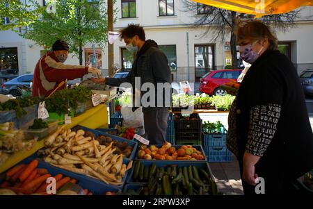 200421 -- PRAGUE, April 21, 2020 Xinhua -- People buy vegetables at a farm product market allowed to reopen on Monday in Prague, the Czech Republic, April 20, 2020. Photo by Dana Kesnerova/Xinhua CZECH REPUBLIC-PRAGUE-FARM MARKET PUBLICATIONxNOTxINxCHN Stock Photo