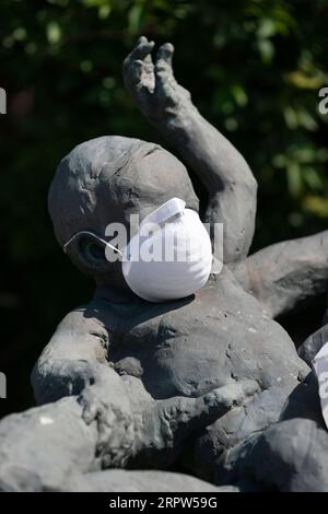 200421 -- PRESTATYN BRITAIN, April 21, 2020 Xinhua -- Photo taken on April 21, 2020 shows a statue of a child with a mask in Prestatyn in Wales, Britain. Another 823 people who tested positive for COVID-19 have died in hospitals in Britain as of Monday afternoon, bringing the total number of COVID-19-related deaths to 17,337, the Department of Health and Social Care said Tuesday. As of Tuesday morning, 129,044 people have tested positive for COVID-19, marking a daily increase of 4,301, said the department. Photo by Jon Super/Xinhua BRITAIN-PRESTATYN-COVID-19-CASES PUBLICATIONxNOTxINxCHN Stock Photo