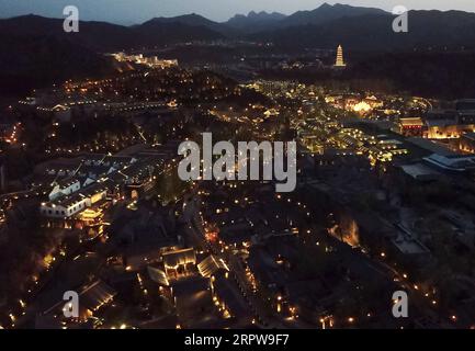 200423 -- BEIJING, April 23, 2020 -- Aerial photo taken on April 23, 2020 shows a night view of the Gubei Water Town in Beijing, capital of China.  CHINA-BEIJING-GUBEI WATER TOWN-SCENERY CN ZhangxChenlin PUBLICATIONxNOTxINxCHN Stock Photo