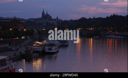 The river Vltava and prague castle at dusk Stock Photo