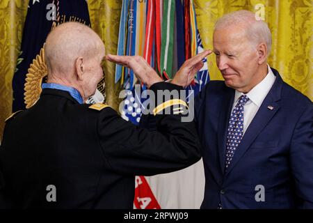 Washington, United States. 05th Sep, 2023. President Joe Biden returns U.S. Army Captain Larry Taylor's salute after presenting him with the Medal of Honor during a ceremony in the East Room at the White House in Washington, DC on Tuesday, September 5, 2023. Captain Taylor is being awarded the Medal of Honor for actions he took in 1968 while serving as a team leader of a helicopter light-fire team that directly resulted in the rescue of a 4-man reconnaissance patrol that became surrounded by overwhelming enemy forces. (Photo by Samuel Corum/Sipa USA) Credit: UPI/Alamy Live News Stock Photo