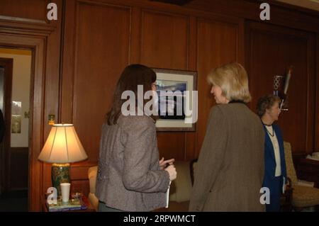 Secretary Gale Norton, right foreground, preparing for visit of Alaska delegation, led by Mayor Edward Sagaan Itta of North Slope Borough, to Department of Interior headquarters for discussions concerning the environmental impact of Teshekpuk Lake and Chukchi Sea oil and gas resource development plans Stock Photo