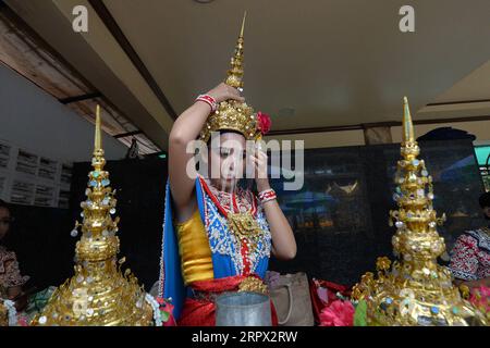 200504 -- BANGKOK, May 4, 2020 Xinhua -- A Thai dancer wearing a face shield arranges the costume at the Erawan Shrine in Bangkok, Thailand, May 4, 2020. Xinhua/Rachen Sageamsak THAILAND-BANGKOK-COVID-19 PUBLICATIONxNOTxINxCHN Stock Photo