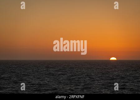San Francisco, CA, USA - July 13, 2023: 4 of 4, Pacific Ocean sunset west of San Francisco. Blackish water. Stock Photo
