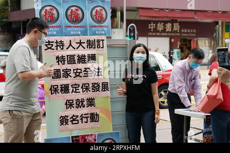 200524 -- HONG KONG, May 24, 2020 -- Residents attend a street campaign in support of national security legislation for Hong Kong Special Administrative Region HKSAR in Hong Kong, south China, May 23, 2020.  CHINA-HONG KONG-RESIDENT-SUPPORT-NATIONAL SECURITY LEGISLATION CN LixGang PUBLICATIONxNOTxINxCHN Stock Photo