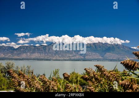Storm clouds ;hovering over Mt. Timpanogos, Provo, UT. USA. Seen from the west shores of Utah Lake. Stock Photo