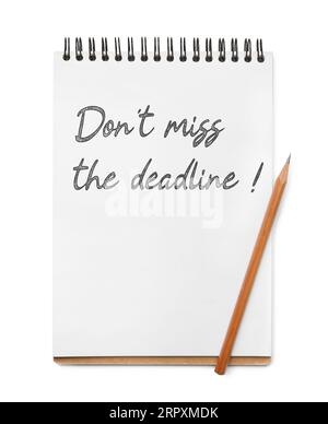 Notebook with reminder Don't Miss The Deadline and pencil on white background, top view Stock Photo