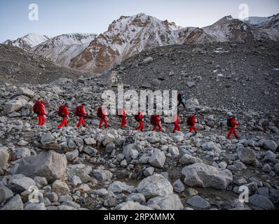 200528 -- MOUNT QOMOLANGMA BASE CAMP, May 28, 2020 -- Members of a Chinese surveying team are on the way back to the Mount Qomolangma base camp on May 28, 2020. A Chinese surveying team safely descended to the Mount Qomolangma base camp at an altitude of 5,200 meters Thursday, after completing the mission of remeasuring the height of the world s highest peak.  CHINA-MOUNT QOMOLANGMA-SUMMIT-SURVEYS-DESCEND CN SunxFei PUBLICATIONxNOTxINxCHN Stock Photo