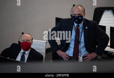 May 30, 2020, Cape Canaveral, FL, United States of America: Ken Bowersox, acting Associate Administrator for NASA Human Exploration and Operations Mission Directorate, left, and NASA Associate Administrator Steve Jurczyk, monitor the launch of a SpaceX Falcon 9 rocket carrying the Crew Dragon spacecraft from mission control at the Kennedy Space Center May 30, 2020 Cape Canaveral, in Florida. The spacecraft carried astronauts Douglas Hurley and Robert Behnken into orbit on their way to the International Space Station. Credit Image: /Planet Pix via ZUMA Wire Successful Launch of the NASA SpaceX Stock Photo