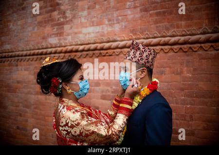 200602 -- BEIJING, June 2, 2020 -- A bride and her groom wear face masks at their wedding ceremony in Kathmandu, Nepal, on May 1, 2020. Photo by /Xinhua Portraits of May 2020 SulavxShrestha PUBLICATIONxNOTxINxCHN Stock Photo