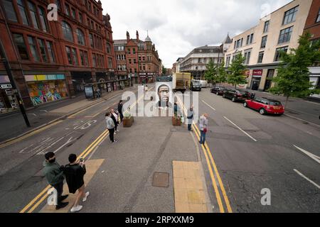 200605 -- MANCHESTER, June 5, 2020 -- People are seen by a mural of George Floyd, who was suffocated to death while under police custody in the mid-western U.S. state of Minnesota last week, in central Manchester, Britain, on June 4, 2020. Photo by /Xinhua BRITAIN-MANCHESTER-GEORGE FLOYD-MURAL JonxSuper PUBLICATIONxNOTxINxCHN Stock Photo