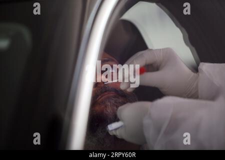 200616 -- BEIJING, June 16, 2020 -- A medical worker collects a sample at a drive-through testing site in Cairo, Egypt, June 15, 2020.  XINHUA PHOTOS OF THE DAY AhmedxGomaa PUBLICATIONxNOTxINxCHN Stock Photo