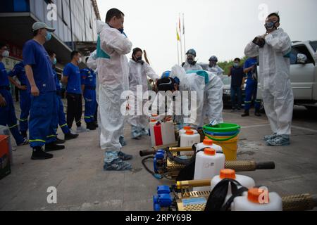 200616 -- BEIJING, June 16, 2020 -- Members of the Beijing Blue Sky RescueBSR team prepare to conduct disinfection at the Yuegezhuang wholesale market in Beijing, capital of China, June 16, 2020. Beijing has disinfected 276 farm produce markets and closed 11 such underground and semi-underground markets as of 6 a.m. Tuesday to better curb the spread of the novel coronavirus, Chen Yankai, deputy director of the municipal market supervision bureau, told a press conference on Tuesday. A total of 33,173 catering service providers have also been disinfected, Chen added.  CHINA-BEIJING-COVID-19-DISI Stock Photo