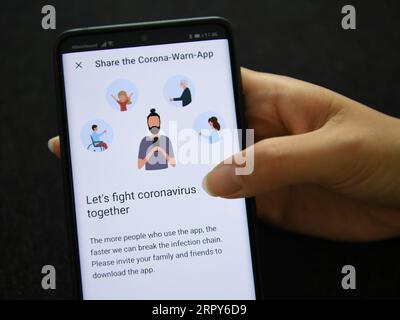 200616 -- FRANKFURT, June 16, 2020 -- Photo taken on June 16, 2020 in Frankfurt, Germany shows the Germany s official COVID-19 warning app on a smartphone. Germany launched its official COVID-19 warning app which was now available for download to smartphones, the government announced on Tuesday.  GERMANY-FRANKFURT-COVID-19-WARNING APP LuxYang PUBLICATIONxNOTxINxCHN Stock Photo