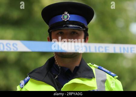 200621 -- READING BRITAIN, June 21, 2020 Xinhua -- A police officer stands behind a police cordon at an entrance to Forbury Gardens where stabbings took place in Reading, Britain, on June 21, 2020. Britain s counter-terrorism police said Sunday that the stabbing incident taking place in southern England s town of Reading on Saturday night has now been declared a terrorist incident. Photo by Tim Ireland/Xinhua BRITAIN-READING-STABBING-TERRORIST INCIDENT PUBLICATIONxNOTxINxCHN Stock Photo