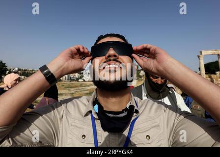 200702 -- BEIJING, July 2, 2020 -- A man observes a partial solar eclipse through a goggle at the Citadel archaeological site in Amman, Jordan, June 21, 2020. Photo by /Xinhua Portraits of June 2020 MohammadxAbuxGhosh PUBLICATIONxNOTxINxCHN Stock Photo