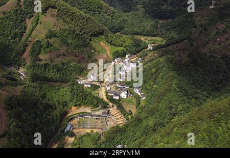 200709 -- HUANGSHAN, July 9, 2020 -- Aerial photo taken on July 9, 2020 shows a view of Zhangcun Village in Huizhou District of Huangshan City, east China s Anhui Province. Heavy rainfall hit the Huizhou District of Huangshan City, leaving several villages inundated in varying degrees. The local authorities rapidly organized flood response efforts to evacuate effected residents, rehabilitate destroyed roads and dredge silt-clogged ditches.  CHINA-ANHUI-HUANGSHAN-FLOOD-RESPONSE CN ZhouxMu PUBLICATIONxNOTxINxCHN Stock Photo