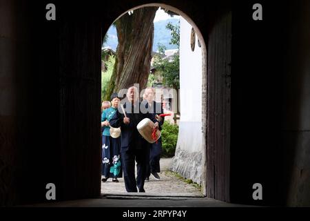 200711 -- FUZHOU, July 11, 2020 -- Villagers demonstrate a funeral ritual for deceased carp in Puyuan Village, Puyuan Township, Zhouning County, southeast China s Fujian Province, July 4, 2020. At the first glance, Puyuan Village appears no difference from other historical villages in China. But it s the carp fish in a local creek, known as the Carp Brook, that make the village special. Puyuan village covers an area of 9.2 square kilometers and has a population of about 6,200. Originated from the Ziyun Mountain, several streams converge into the 3,000-meter-long Carp Brook, with 800 meters of Stock Photo