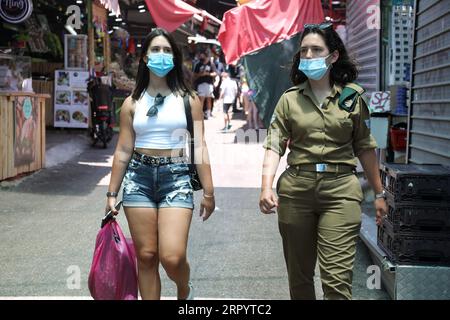 200715 -- TEL AVIV, July 15, 2020 Xinhua -- Israelis wearing face masks are seen in a market in central Israeli city of Tel Aviv amid COVID-19 pandemic on July 14, 2020. Israel s Ministry of Health reported 1,728 new coronavirus cases on Tuesday, bringing the total cases to 42,360. Gideon Markowicz/JINI via Xinhua ISRAEL-TEL AVIV-COVID-19-CASES PUBLICATIONxNOTxINxCHN Stock Photo