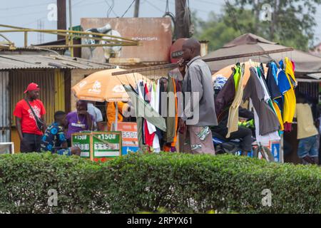 Mobile Vendor Selling Used Clothes on the Street Stock Photo