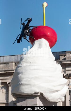 200730 -- LONDON, July 30, 2020 Xinhua -- Photo taken on July 30, 2020 shows the Fourth Plinth sculpture titled The End at Trafalgar Square in London, Britain. A new artwork by artist Heather Phillipson was unveiled Thursday on the Fourth Plinth in London s Trafalgar Square. Entitled THE END, the sculpture tops the Fourth Plinth with a giant swirl of whipped cream, a cherry, a fly and a drone that transmits a live feed of Trafalgar Square. Photo by Ray Tang/Xinhua BRITAIN-LONDON-FOURTH PLINTH SCULPTURE-UNVEILING PUBLICATIONxNOTxINxCHN Stock Photo