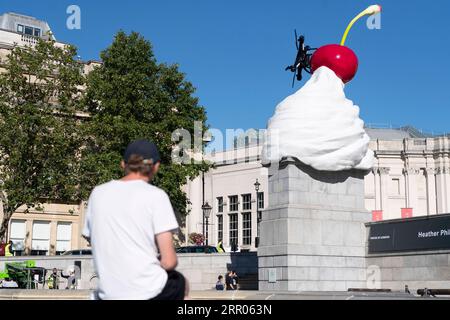 200730 -- LONDON, July 30, 2020 Xinhua -- Photo taken on July 30, 2020 shows the Fourth Plinth sculpture titled The End at Trafalgar Square in London, Britain. A new artwork by artist Heather Phillipson was unveiled Thursday on the Fourth Plinth in London s Trafalgar Square. Entitled THE END, the sculpture tops the Fourth Plinth with a giant swirl of whipped cream, a cherry, a fly and a drone that transmits a live feed of Trafalgar Square. Photo by Ray Tang/Xinhua BRITAIN-LONDON-FOURTH PLINTH SCULPTURE-UNVEILING PUBLICATIONxNOTxINxCHN Stock Photo