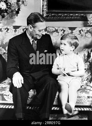 File photo dated 14/11/51 of King George VI with his then grandson Prince Charles celebrating his third birthday at Buckingham Palace, London. King Charles III has clocked up more days of official engagements in his first 12 months as monarch than his mother did during her first year as Queen, but not quite as many as his grandfather George VI, new analysis shows. Issue date: Wednesday September 6, 2023. Stock Photo