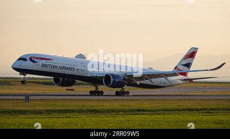 Richmond, British Columbia, Canada. 5th Sep, 2023. A British Airways Airbus A350-1000 jetliner (G-XWBM) lands at sunset, Vancouver International Airport. (Credit Image: © Bayne Stanley/ZUMA Press Wire) EDITORIAL USAGE ONLY! Not for Commercial USAGE! Stock Photo