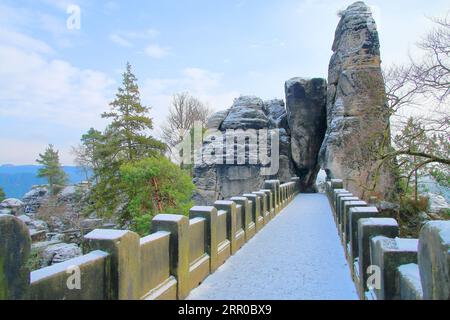 The photo was taken in Germany, in the mountains of Saxony. The picture shows a picturesque stone bridge called the Bastei. Stock Photo